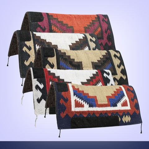 Three patterned saddle blankets on a light purple background